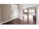 Entryway with wood floors leading to a living area and sliding glass doors at 505 W Hunters Dr # D, Carmel, IN 46032