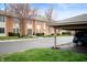 Exterior shot showcasing the building's architecture and a carport on the right at 505 W Hunters Dr # D, Carmel, IN 46032