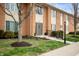 Charming brick exterior with well-maintained landscaping and inviting front entrance at 505 W Hunters Dr # D, Carmel, IN 46032