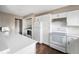 Bright kitchen with white cabinets, modern appliances, and ample counter space at 505 W Hunters Dr # D, Carmel, IN 46032