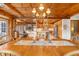 Elegant dining room with wood accents, chandelier, and view into a stylish kitchen area at , Columbus, IN 47201