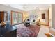 A well lit room featuring a ceiling fan, plush sofa, and glass doors to the exterior at , Columbus, IN 47201