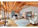 Inviting living room with stone fireplace, wood ceilings, hardwood floors and cozy furniture at , Columbus, IN 47201