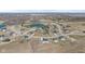 Picturesque aerial view of a neighborhood with a serene pond, surrounded by beautifully landscaped homes at 5189 Abbeygate Blvd, Bargersville, IN 46106