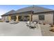Spacious backyard featuring an outdoor kitchen and dining area, perfect for entertaining at 5189 Abbeygate Blvd, Bargersville, IN 46106