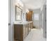 Elegant bathroom featuring double vanities, a walk-in shower, and modern fixtures for a spa-like experience at 5189 Abbeygate Blvd, Bargersville, IN 46106