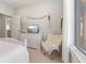 Well-lit bedroom featuring a cozy chair and modern decor for comfort at 5189 Abbeygate Blvd, Bargersville, IN 46106