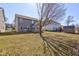 Spacious backyard with lawn and shade tree at 5402 Basin Park Dr, Indianapolis, IN 46239