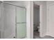 A walk-in shower with modern glass doors and sleek fixtures enhances the bathroom's functionality at 5402 Basin Park Dr, Indianapolis, IN 46239