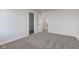 The bedroom is carpeted and has doorways to a closet and staircase at 5402 Basin Park Dr, Indianapolis, IN 46239