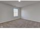 Bright bedroom with a window allowing natural light and neutral carpeting at 5402 Basin Park Dr, Indianapolis, IN 46239