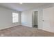A bright bedroom has a window and door to a closet for storage at 5402 Basin Park Dr, Indianapolis, IN 46239