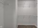 A walk-in closet with wire shelving and neutral carpeting provides ample storage at 5402 Basin Park Dr, Indianapolis, IN 46239