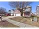 Two-story home with brick and siding exterior, three-car garage, and sidewalk at 5402 Basin Park Dr, Indianapolis, IN 46239
