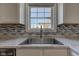 Close-up of the kitchen sink and countertop showing the stainless faucet at 5402 Basin Park Dr, Indianapolis, IN 46239