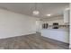 Bright open-concept eat-in kitchen featuring white cabinets at 5402 Basin Park Dr, Indianapolis, IN 46239