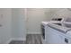 Convenient laundry area features modern appliances and ample space for sorting and folding at 5402 Basin Park Dr, Indianapolis, IN 46239
