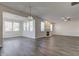 Spacious open living room area with dark floors and fireplace feature at 5402 Basin Park Dr, Indianapolis, IN 46239