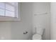 A powder room features a modern toilet and convenient towel rack for guests at 5402 Basin Park Dr, Indianapolis, IN 46239