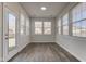 Cozy sun room with hardwood floors and plenty of natural light at 5402 Basin Park Dr, Indianapolis, IN 46239