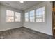 Bright sunroom with neutral walls, wood-look flooring and lots of windows lets in plenty of natural light at 5402 Basin Park Dr, Indianapolis, IN 46239