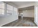 Open concept living space with wood-look floors, neutral walls and lots of natural light at 5402 Basin Park Dr, Indianapolis, IN 46239