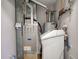 This home utility area includes a modern furnace, water heater, and water softener at 5402 Basin Park Dr, Indianapolis, IN 46239