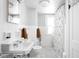 Bathroom featuring a vintage sink, tiled walls, and modern fixtures at 5426 Broadway St, Indianapolis, IN 46220