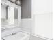 Classic bathroom with a vanity, a framed mirror, and ample natural light at 5426 Broadway St, Indianapolis, IN 46220