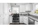 Charming kitchen featuring white cabinets, granite countertops, and stainless steel appliances at 5426 Broadway St, Indianapolis, IN 46220