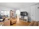 Open living room featuring hardwood floors, neutral walls, and ample natural light at 5426 Broadway St, Indianapolis, IN 46220