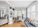 Bright home office space featuring hardwood floors, large windows, and built-in shelving at 5426 Broadway St, Indianapolis, IN 46220
