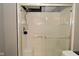 Bathroom features a shower with glass door and tile surround at 5855 Dapple Trce, Indianapolis, IN 46228