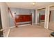 Bedroom with mirrored closet doors and wood headboard and neutral carpet at 5855 Dapple Trce, Indianapolis, IN 46228