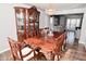 Spacious dining room features a wood table, ornate carved chairs and a china cabinet at 5855 Dapple Trce, Indianapolis, IN 46228