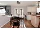 Eat-in kitchen with marble breakfast bar, stainless steel appliances, and access to the backyard at 5855 Dapple Trce, Indianapolis, IN 46228