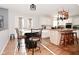 Bright, eat-in kitchen with white marble breakfast bar, hardwood floors, and stainless steel appliances at 5855 Dapple Trce, Indianapolis, IN 46228