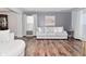 Cozy living room featuring stylish decor, hardwood flooring, and neutral gray color scheme at 5855 Dapple Trce, Indianapolis, IN 46228