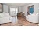 Comfortable living room with hardwood floors and lots of natural light from the window at 5855 Dapple Trce, Indianapolis, IN 46228