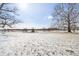 Spacious snowy backyard with mature trees, and playground, offering ample space for recreation and relaxation at 6024 N County Road 50 W, Lizton, IN 46149
