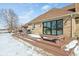 Backyard deck with seating, providing an ideal outdoor living space, against a brick home exterior at 6024 N County Road 50 W, Lizton, IN 46149