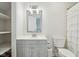 A half bath with vanity, soft lighting, and storage at 6024 N County Road 50 W, Lizton, IN 46149