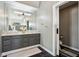 Bathroom featuring a double vanity with a decorative mirror and shower access at 6024 N County Road 50 W, Lizton, IN 46149