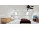 Carpeted bedroom with skylights, ceiling fan and crib at 6024 N County Road 50 W, Lizton, IN 46149