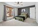 A comfortable bedroom with a picture window, a ceiling fan, and cozy decor for a relaxed atmosphere at 6024 N County Road 50 W, Lizton, IN 46149