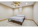 Cozy bedroom with neutral color scheme and plush carpet, complemented by a ceiling fan for added comfort at 6024 N County Road 50 W, Lizton, IN 46149