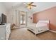 Cozy bedroom with plush carpet, a ceiling fan, and a large window with a view at 6024 N County Road 50 W, Lizton, IN 46149