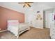 Bright bedroom features a vaulted ceiling, plush carpet, and neutral wall color with a charming accent wall at 6024 N County Road 50 W, Lizton, IN 46149