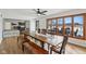 Bright dining room with wood floors and long table adjacent to the kitchen at 6024 N County Road 50 W, Lizton, IN 46149