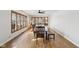 Bright dining room with wood floors, a long table, windows, and a ceiling fan at 6024 N County Road 50 W, Lizton, IN 46149